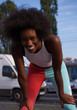 Portrait of sporty young african american woman running outdoors