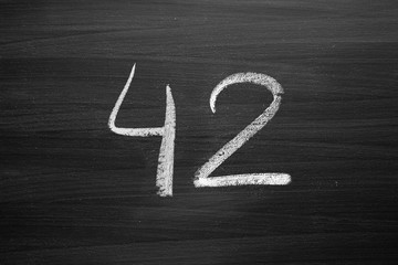 Wall Mural - number forty two enumeration written with a chalk on the blackboard