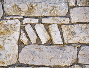 decorative pattern of a solid stone wall closeup