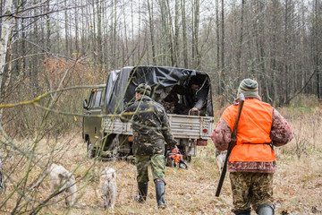 hunters with the machine in the impenetrable forest