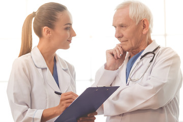 Wall Mural - Old and young doctors