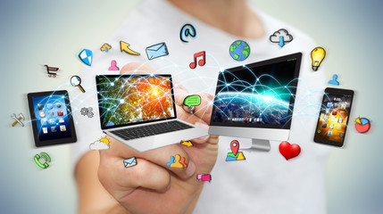 Wall Mural - businessman using a pen to connect devices