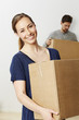 © sanneberg - Beautiful woman moving home, portrait