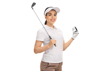 Wall Mural - Female golfer holding a golf club and a ball