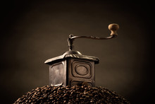 Coffee Grinder On Top Of Hill Of Beans