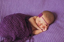 Charming  Newborn Girl  Sleeping On The Bed