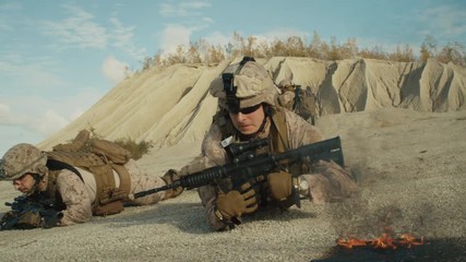 Wall Mural -  Squad of Fully Equipped and Armed Soldiers Crawling During Military Operation in the Desert. Shot on RED EPIC Cinema Camera in 4K (UHD).