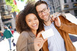 © goodluz - Couple in Manhattan showing shopping card