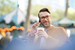 © goodluz - Trendy guy at Bryant park using smartphone