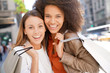 © goodluz - Girlfriends in Manhattan doing shopping on sunny day