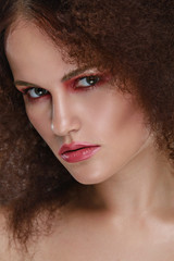 Beauty closeup portrait of young caucasian girl. Woman looking at camera. Beautiful fashion luxury makeup.