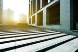 Fototapeta  - empty footpath between modern building with sunbeam