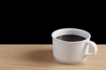 cup of coffee on the wooden table