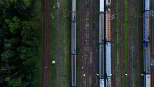 Aerial View Of Railroad Station. Trains And Carriages In A Sump.