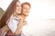 © Davide Angelini - Portrait of a beatiful loving couple having fun at the beach.