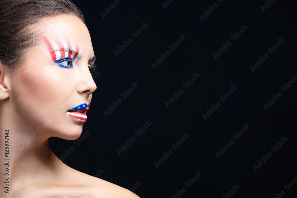 Girl with USA makeup on black background
