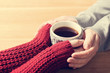 © Photocreo Bednarek - A couple in love warming hands with a hot mug of tea