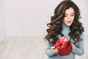 Beautiful woman open red gift shape heart.