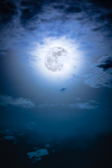 Wall Mural - Nighttime sky with clouds and bright full moon with shiny.