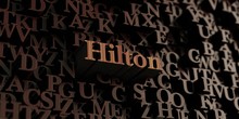 Hilton - Wooden 3D Rendered Letters/message.  Can Be Used For An Online Banner Ad Or A Print Postcard.