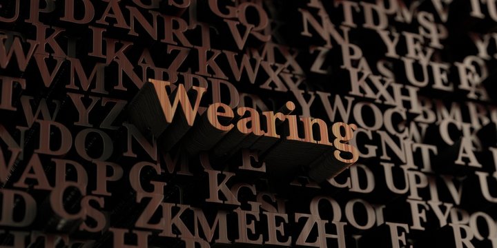 Wearing - Wooden 3D rendered letters/message.  Can be used for an online banner ad or a print postcard.