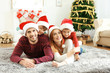 © Africa Studio - Happy family in living room decorated for Christmas