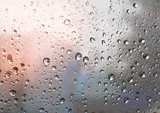 Fototapeta Tęcza - Water drops on car glass.