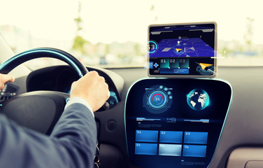 Wall Mural - close up of man driving car with navigation system