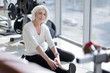 © zinkevych - Attractive inspiring senior woman stretching in the gym