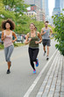 © goodluz - Group of joggers exercising in Manhattan running track