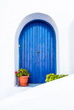 Fototapeta  - white wall with blue door