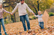 © chika_milan - Dad, mom and son  flying a kite in nature