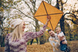 © chika_milan - Dad, mom and son  flying a kite in nature