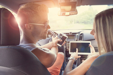 Young people enjoying a roadtrip in the car