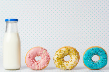Donuts And Bottle Of Milk On Polka Dots Background