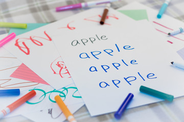 Wall Mural - English; Kids Writing Name of the Fruits for Practice