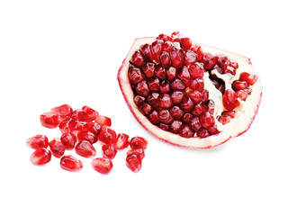 Wall Mural - Part of pomegranate fruit isolated on white background. Closeup.