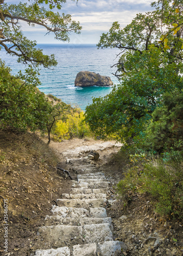 Fototapeta na wymiar Down to the sea. Stairway to Jasper beach at cape Fiolent. Black