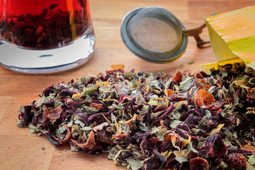 Wall Mural - Herbal and fruit tea on wooden table.