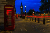 Fototapeta Londyn - Red telephone booth and Big Ben in London, UK. The symbols of London