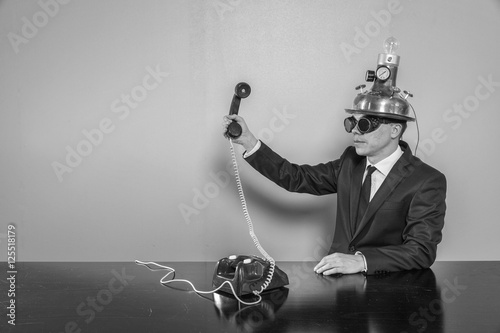 Fototapeta Vintage businessman sitting at office desk