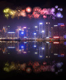 Fototapeta Miasta - Fireworks Festival over Hong Kong city with water reflection