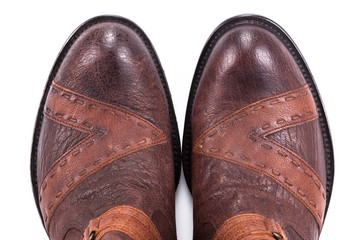 Wall Mural - Men's brown leather shoes in vintage style close-up isolated on white background