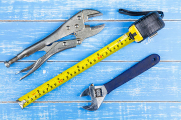 Construction tools on blue wooden table background copy space.ma