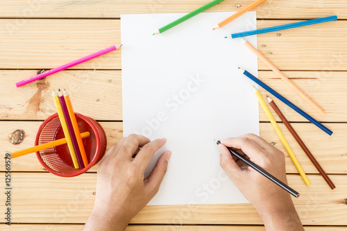Hands Drawing On Paper On Wooden Table Background Stock Photo Adobe Stock