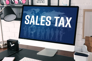 Poster - Modern workplace with computer. Text SALES TAX on screen. Online tax report concept.