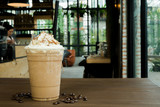 Iced coffee with whipped cream and sprinkle with almonds