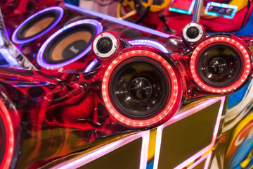 Wall Mural - colorful lights of stereo and speakers in car in the night