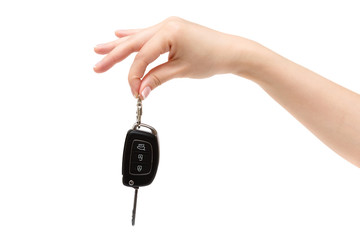 Female hand holds car keys.