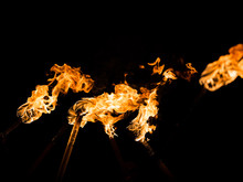 Flaming Torches At Night